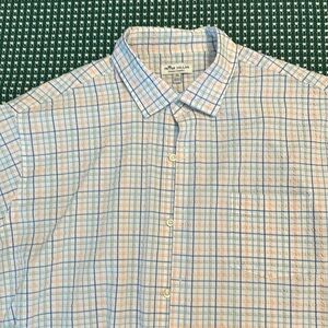 Peter Millar Summer Comfort short sleeve button up with stripes.
